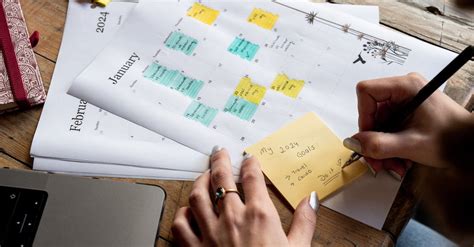 Woman Writing Notes on Calendar · Free Stock Photo
