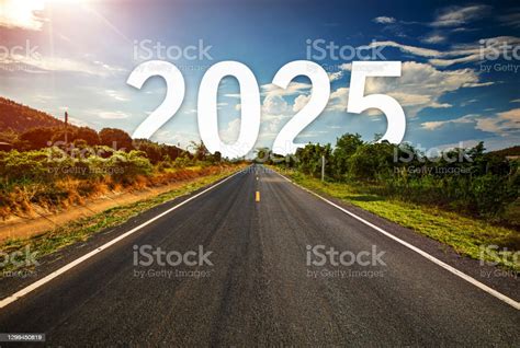The Word 2025 Behind The Tree Of Empty Asphalt Road At Golden Sunset ...